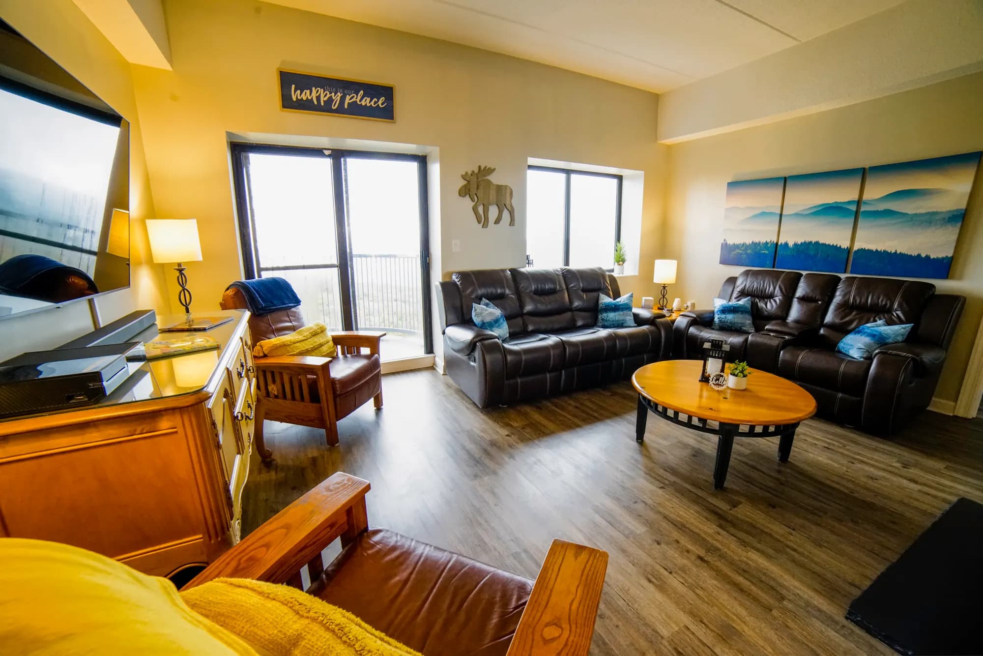 Living room with leather seating and balcony doors